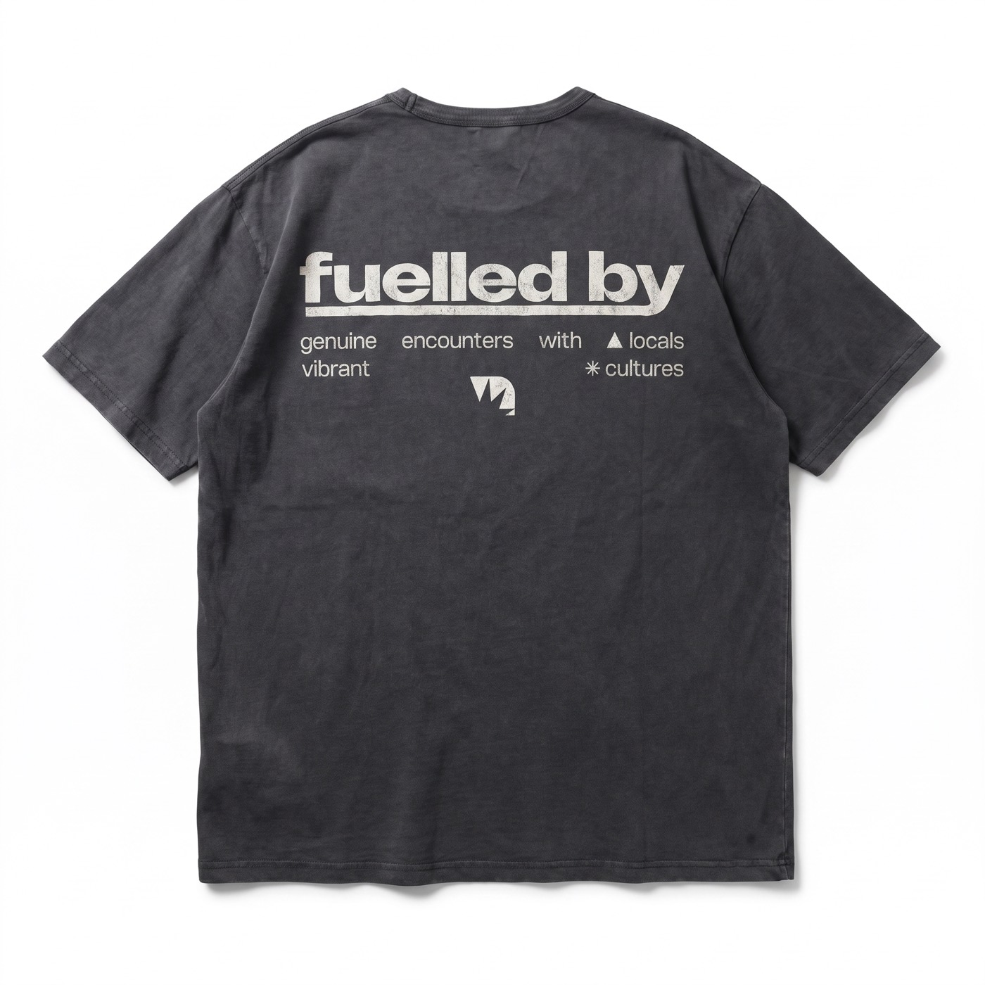 Catalog packshot: black Mezkla t-shirt seen from the back, with a typographic print on a neutral background